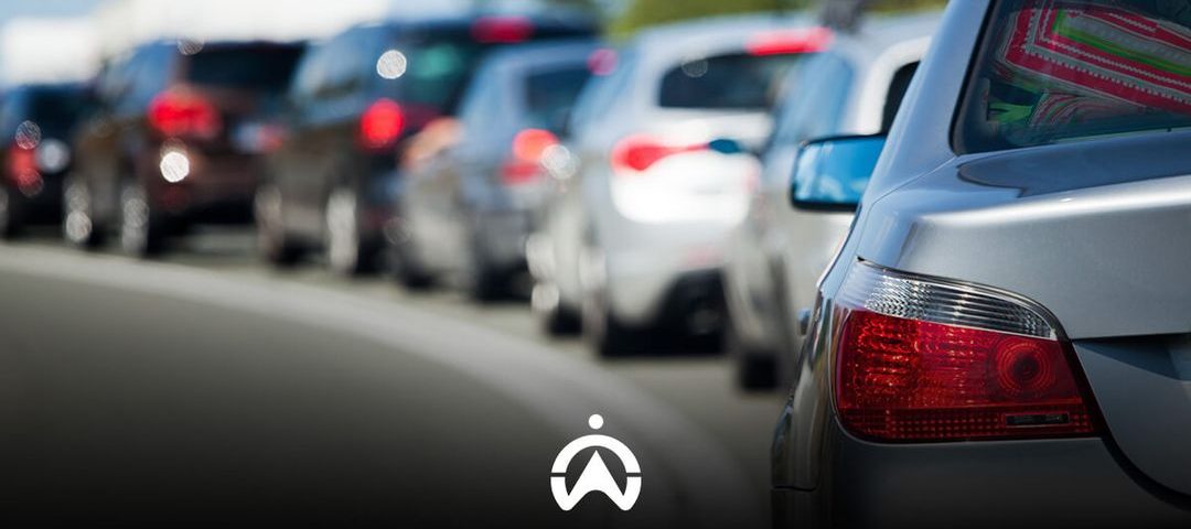 Traffic jam with various cars and activated brake lights.