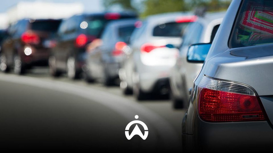 Traffic jam with various cars and activated brake lights.