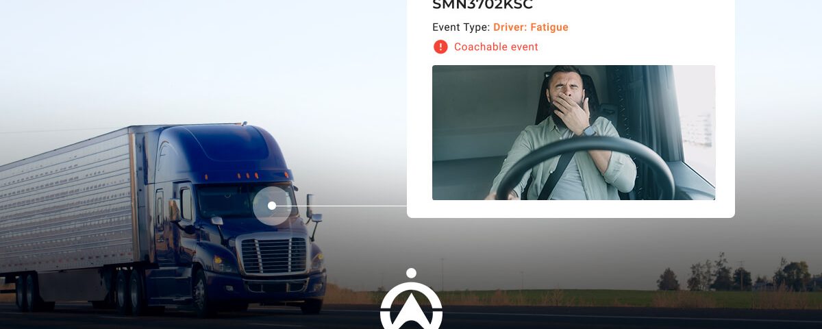 A blue semi-truck on a road with a notification about driver fatigue and a coachee event highlighted on the screen.